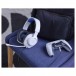 JBL Quantum 100P Wired Over-ear Gaming Headset, PlayStation - Lifestyle with controller