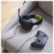 JBL Quantum 100X Wired Over-ear Gaming Headset, Xbox - Lifestyle with Controller