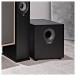 ELAC Debut 2.0 SUB10.2 Subwoofer, Black Ash - Lifestyle Image, focuse on the subwoofer