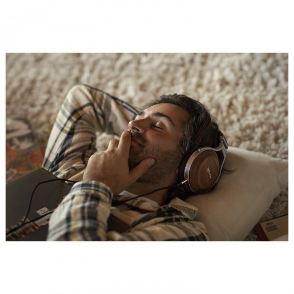 Denon AH-D7200 Reference Quality Over-Ear Headphones - Lifestyle view, listening on floor