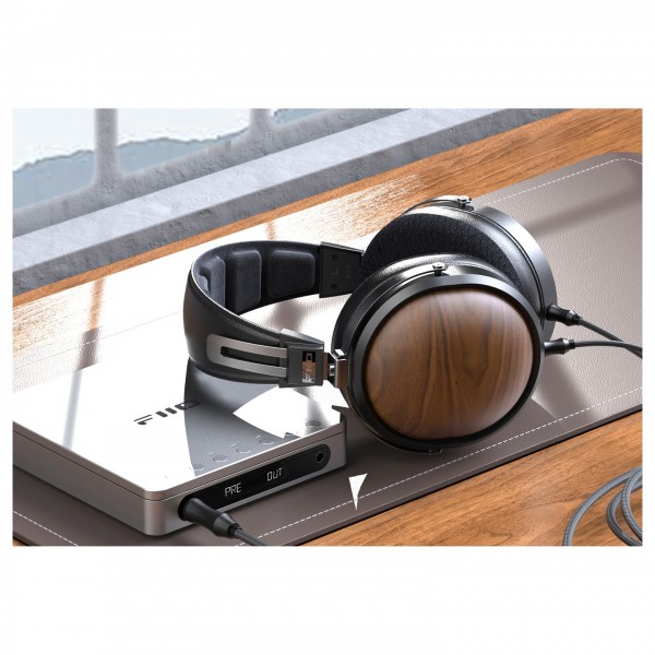 FiiO DM13 Portable CD Player with Bluetooth, Silver - Lifestyle image, connected to headphones