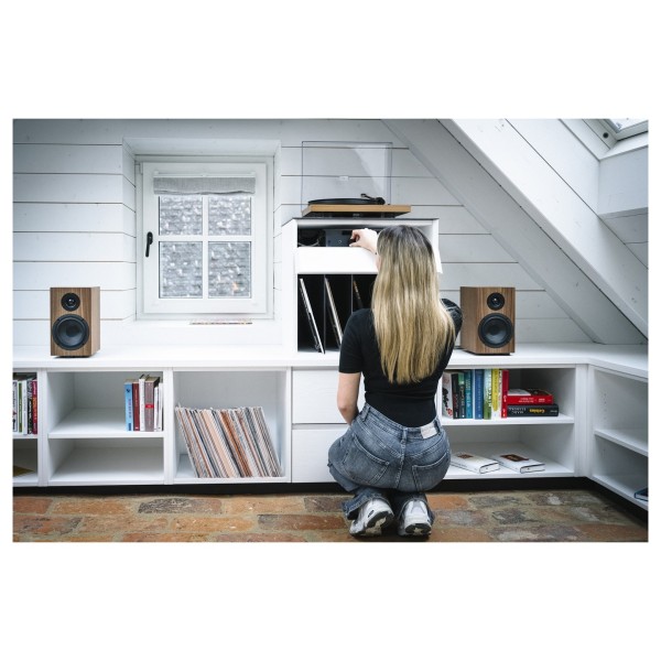 Pro-Ject Colourful Audio System 2, Walnut - Lifestyle Image Searching through vinyl record collection