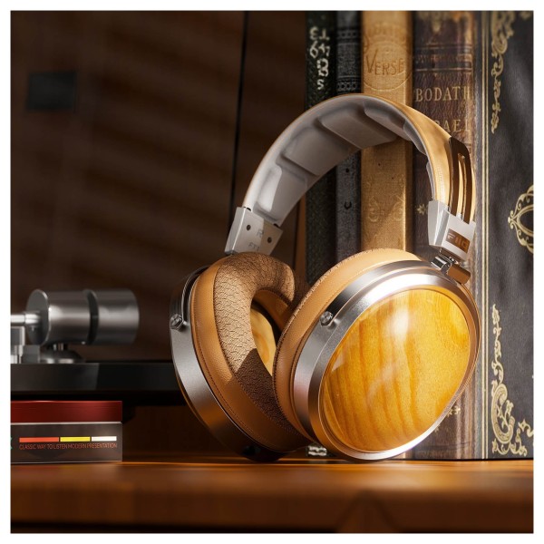 FiiO FT1 32Ω Closed-Back Headphones, Beech - Lifestyle image leant against books
