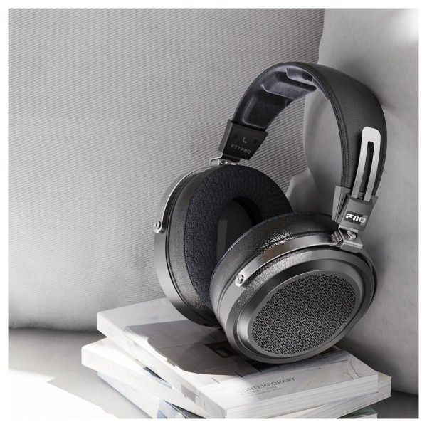 FiiO FT1 Pro Open-Back Planar Magnetic Headphones, Black - Lifestyle Image, sitting on books on a sofa