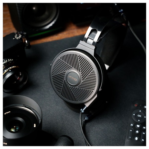 FiiO FT5 Open-Back Planar Magnetic Headphones, Black - Lifestyle Image, on desktop in front of FiiO SP3 Active Speakers