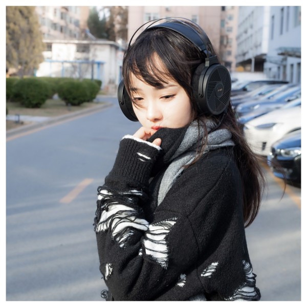 FiiO FT5 Open-Back Planar Magnetic Headphones, Black - Lifestyle Image, modelled outdoors