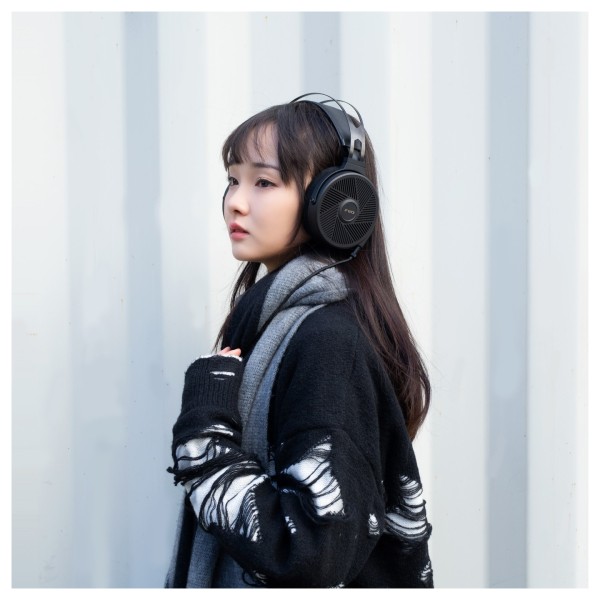 FiiO FT5 Open-Back Planar Magnetic Headphones, Black - Lifestyle Image, modelled outdoors