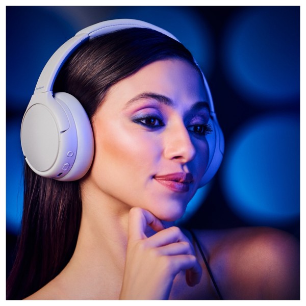 Panasonic RB-M600BE Wireless Stereo Headphones with Hybrid ANC, Beige - Lifestyle Image, modelled angled