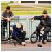 JBL Flip 7 Portable Bluetooth Speaker, Black - Lifestyle view, outdoors, friends on bikes