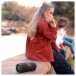 JBL Flip 7 Portable Bluetooth Speaker, Black - Lifestyle view, outdoors, casual listening