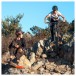 JBL Flip 7 Portable Bluetooth Speaker, Red - Lifestyle image, outdoors, mountain biking with friends