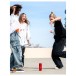 JBL Flip 7 Portable Bluetooth Speaker, Red - Lifestyle image, outdoors, dancing with friends