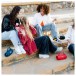 JBL Charge 6 Portable Bluetooth Speaker - Lifestyle Image, Outdoors, sitting on steps, Auracast party