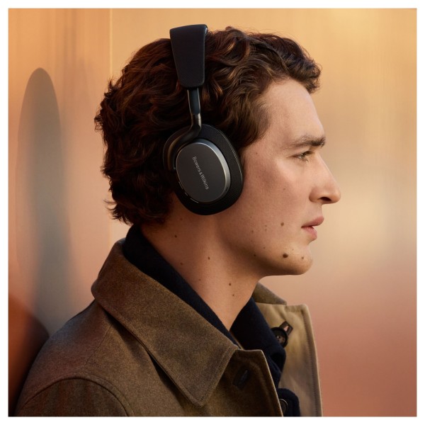 Bowers & Wilkins Px7 S3 Wireless Headphones, Anthracite Black - Lifestyle image, worn by man