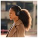 Bowers & Wilkins Px7 S3 Wireless Headphones, Anthracite Black - Lifestyle image, outdoors, worn by woman