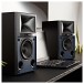 JBL 4305P Wireless Studio Monitor Speakers, Black Walnut - Lifestyle Image, connected to laptop