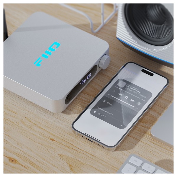 FiiO SR11 Desktop Streaming Music Receiver, Silver - Lifestyle image, wirelessly connected to phone
