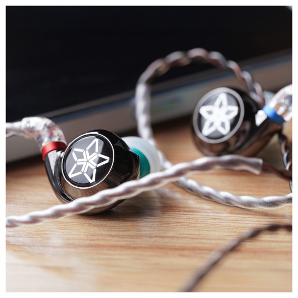 FiiO FH11 Carbon Based Diaphragm In Ear Monitors - Lifestyle image, on desktop next to phone