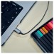 Panasonic RP-TCM225DE USB-C Earphones, Black - Lifestyle Image, use picture, connected to laptop