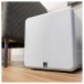 SVS SB1000 Pro Subwoofer, Gloss White - lifestyle with grille