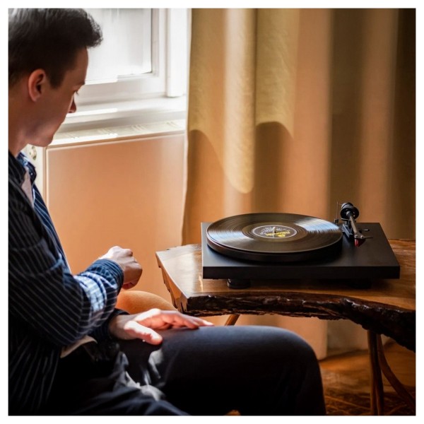 Pro-Ject Debut Carbon Evo Turntable, Satin Black - Lifestyle image, listening to turntable