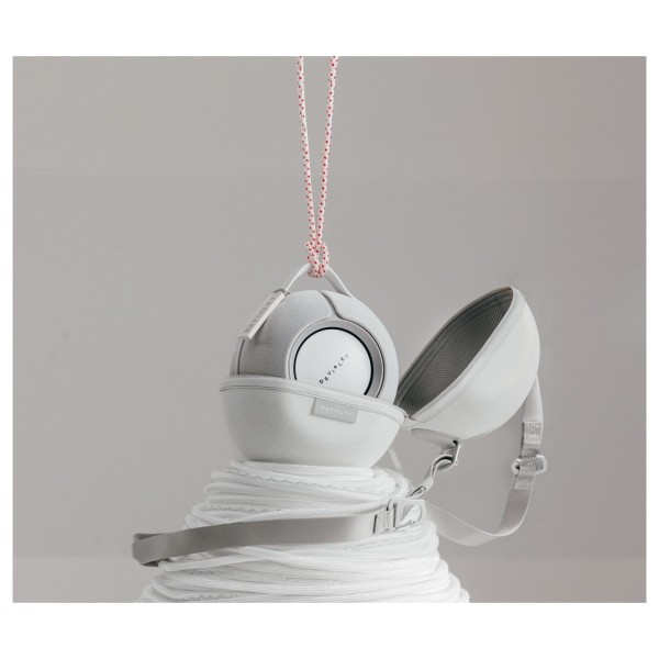 Devialet Mania Portable Wireless Speaker with Cocoon Case, White Mist - lifestyle on pile 