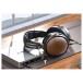 FiiO DM13 Portable CD Player - Lifestyle image, connected to headphones