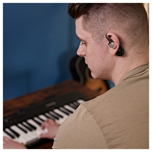 Shure SE215 Sound Isolating Earphones with True Wireless, Clear - over the shoulder 