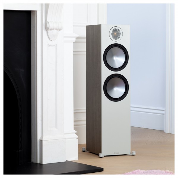 Monitor Audio Bronze 500 Floorstanding Speakers (Pair), Urban Grey standing next to fireplace 